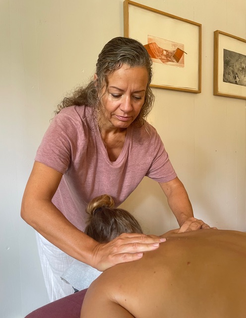 Professional massage therapist Lygia performing massage in Sicily